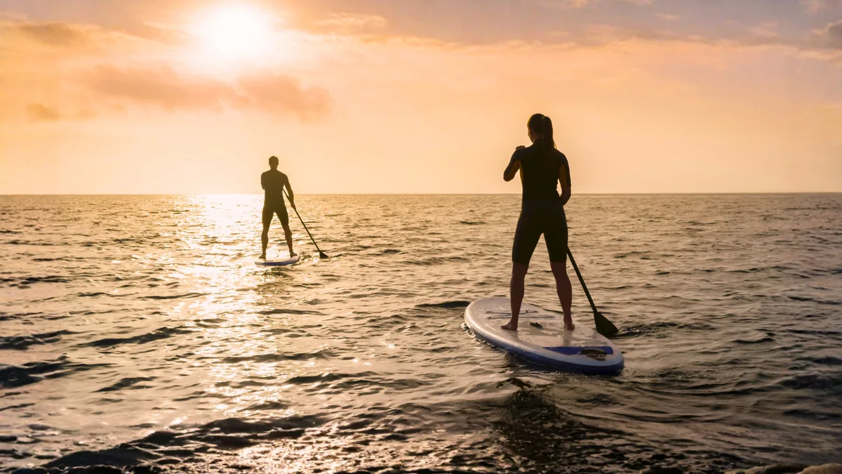 Kayaks and paddleboards on the calm sandy beach at Cape Beach Villa, Koh Samui